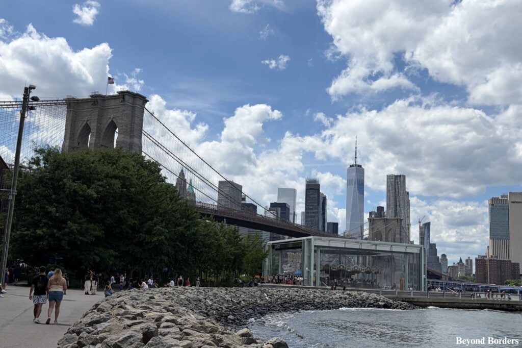 The Brooklyn Bridge, Jane's Carousel, and One WTC in Manhattan seen from Main Street Park in DUMBO, Brooklyn, NYC