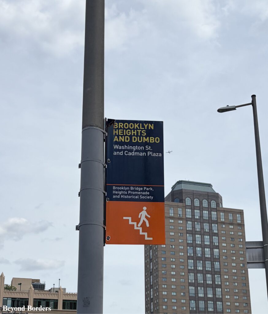 The sign you will see before the stairs going down to Washington Street at the end of the Brooklyn Bridge in NYC