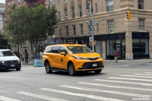 NYC taxi along 6th Ave in the West Village, Manhattan.