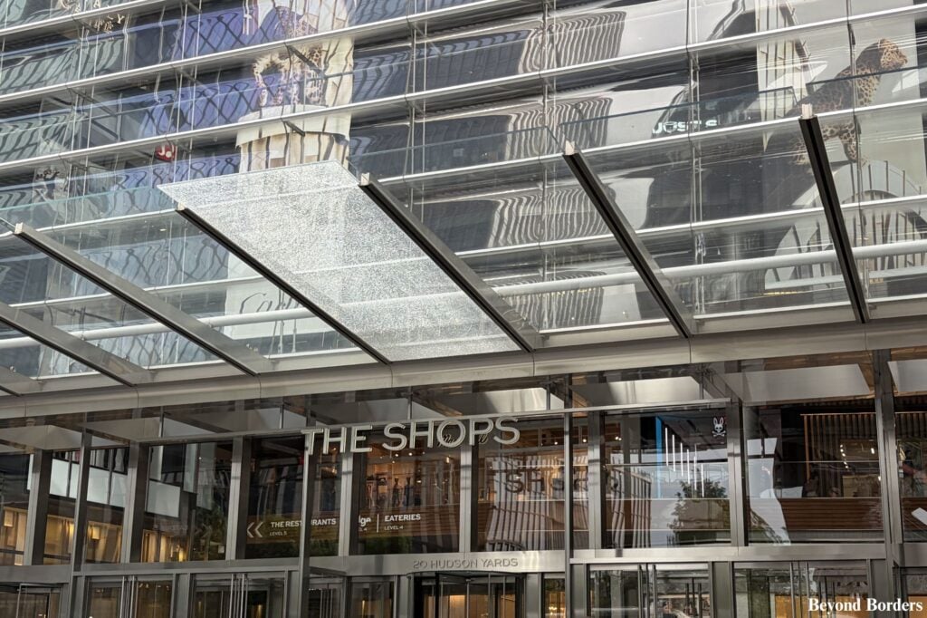 The entrance to the Shops at Hudson Yards facing the Vessel in NYC