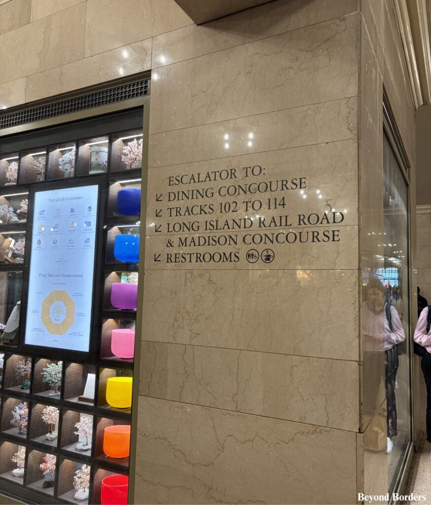 Sign for the dining concourse and restrooms next to the downward escalators in Grand Central Terminal in NYC
