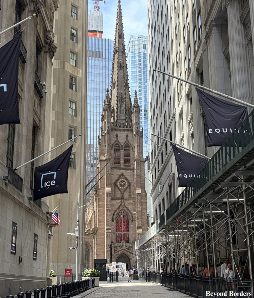 Trinity Church seen from the intersection of Wall St and Nassau St at the corner of the NYSE