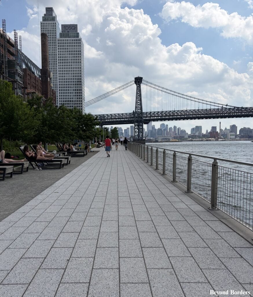 The elevated waterfront walkway in Domino Park in Williamsburg, Brooklyn, NYC
