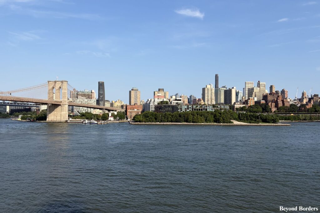 The Brooklyn Bridge and the DUMBO neighborhood in Brooklyn seen from the Pier 17 rooftop at South Street Seaport in NYC