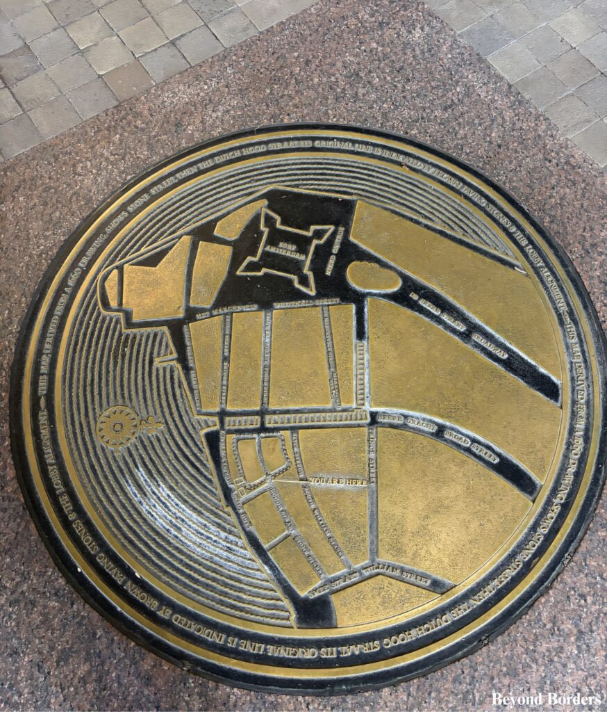 The brass outlines trace the exact foundations of the 1641 Dutch City Hall right in front of the building at 85 Broad Street in Manhattan, NYC