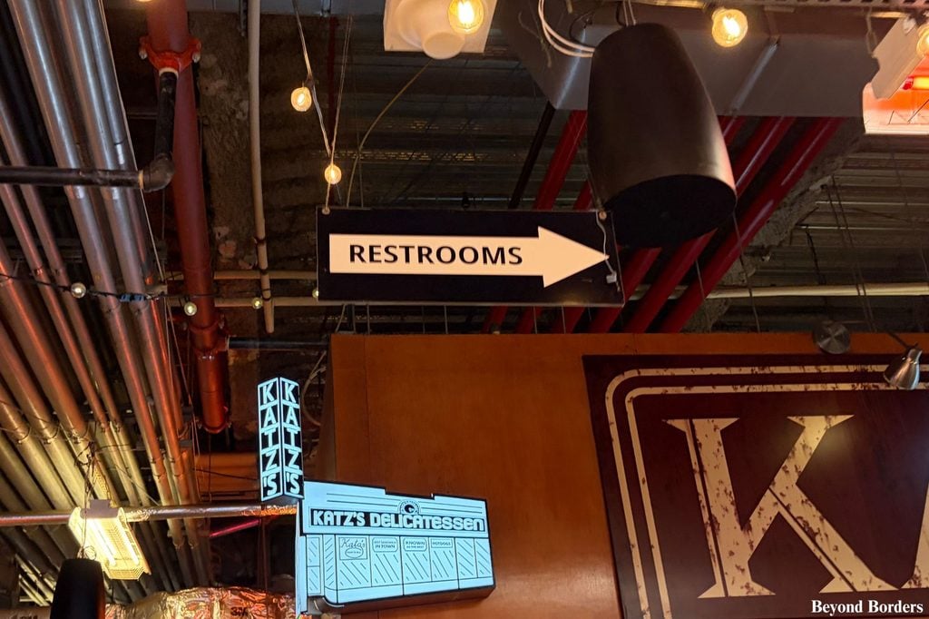 Restrooms sign in DeKalb Market Hall near Katz's Deli vendor in Brooklyn, NYC