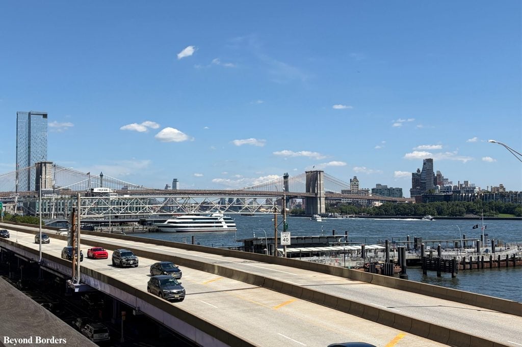 The Brooklyn Bridge, the East River, and DUMBO seen from Elevated Acre in Lower Manhattan, NYC