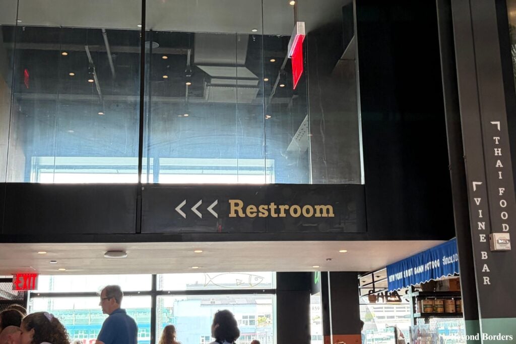 Sign for the restrooms at Market 57 in NYC