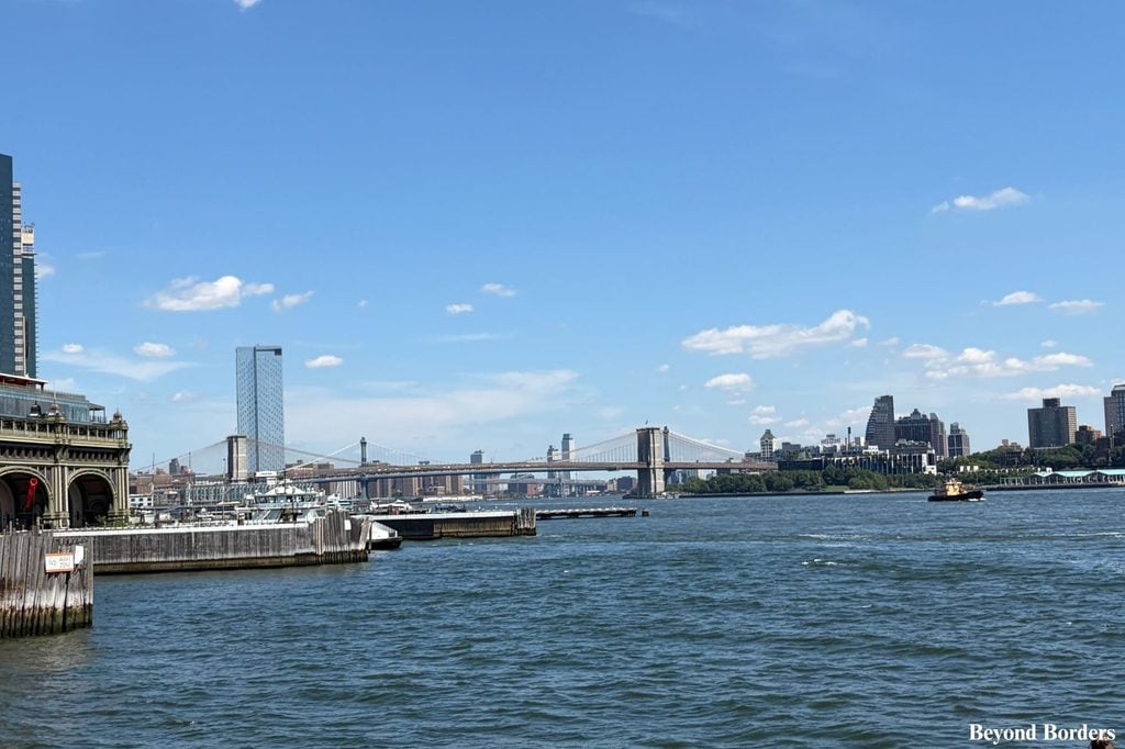 The Brooklyn Bridge seen from the Staten Island Ferry as it pulls into Whitehall Terminal in Lower Manhattan, NYC