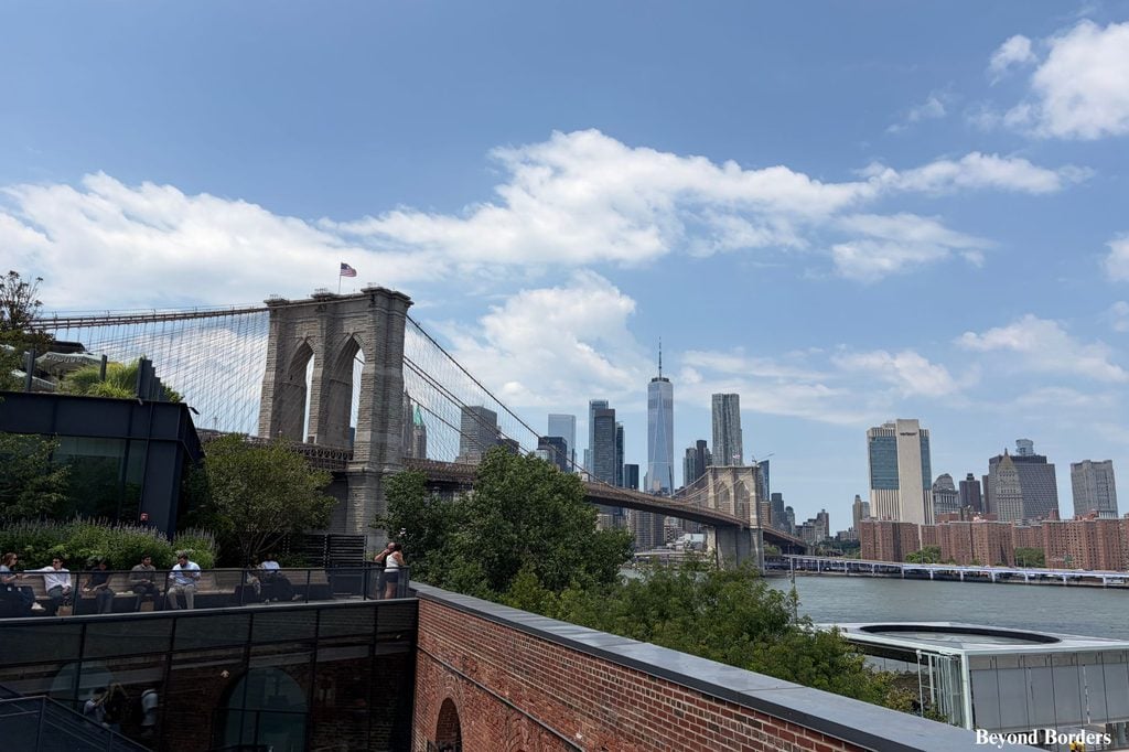 Brooklyn Bridge and One World Trade Center seen from the rooftop at Time Out Market in DUMBO, Brooklyn, NYC