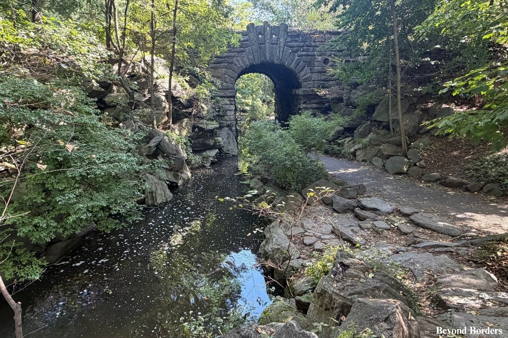 Just east of The Pool is Glen Span Arch, with The Loch on the left in Central Park, Manhattan, NYC