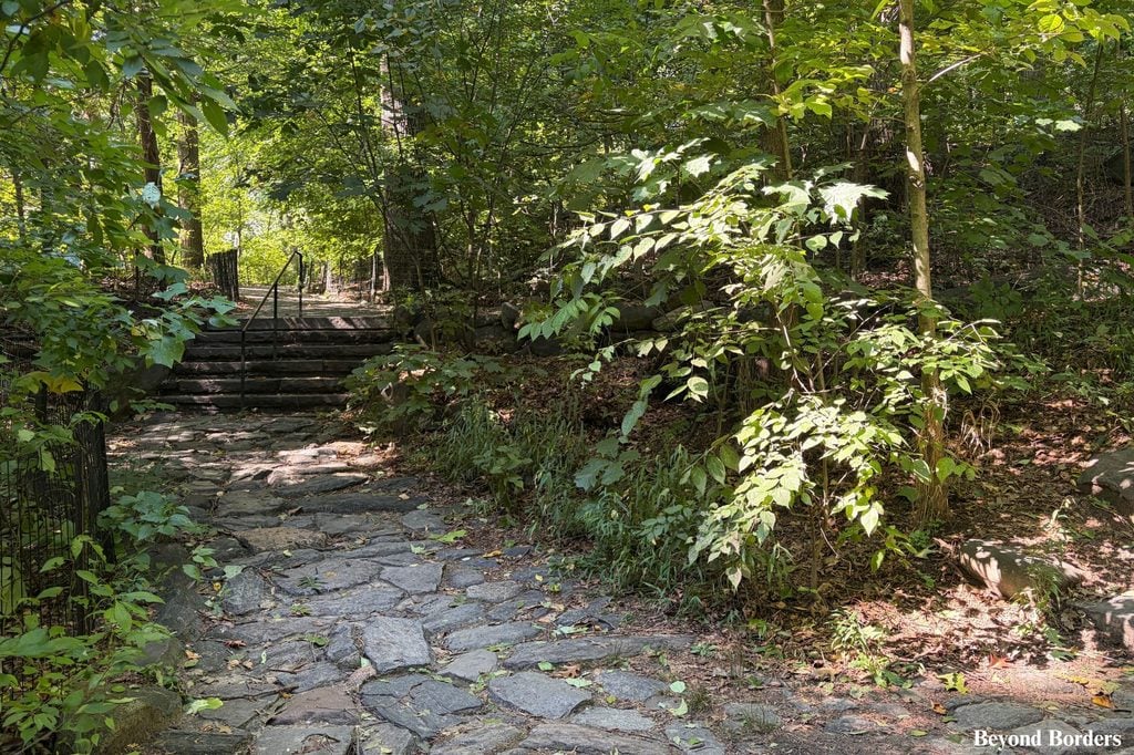 Uneven stone path in the North Woods in Central Park's north end, Manhattan, NYC
